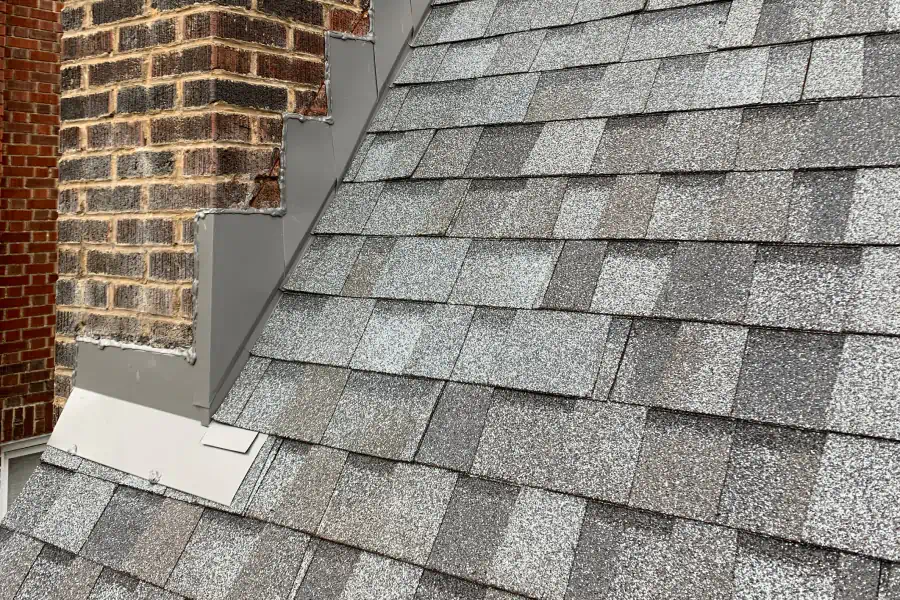 shingle roofing installed in a house with chimney
